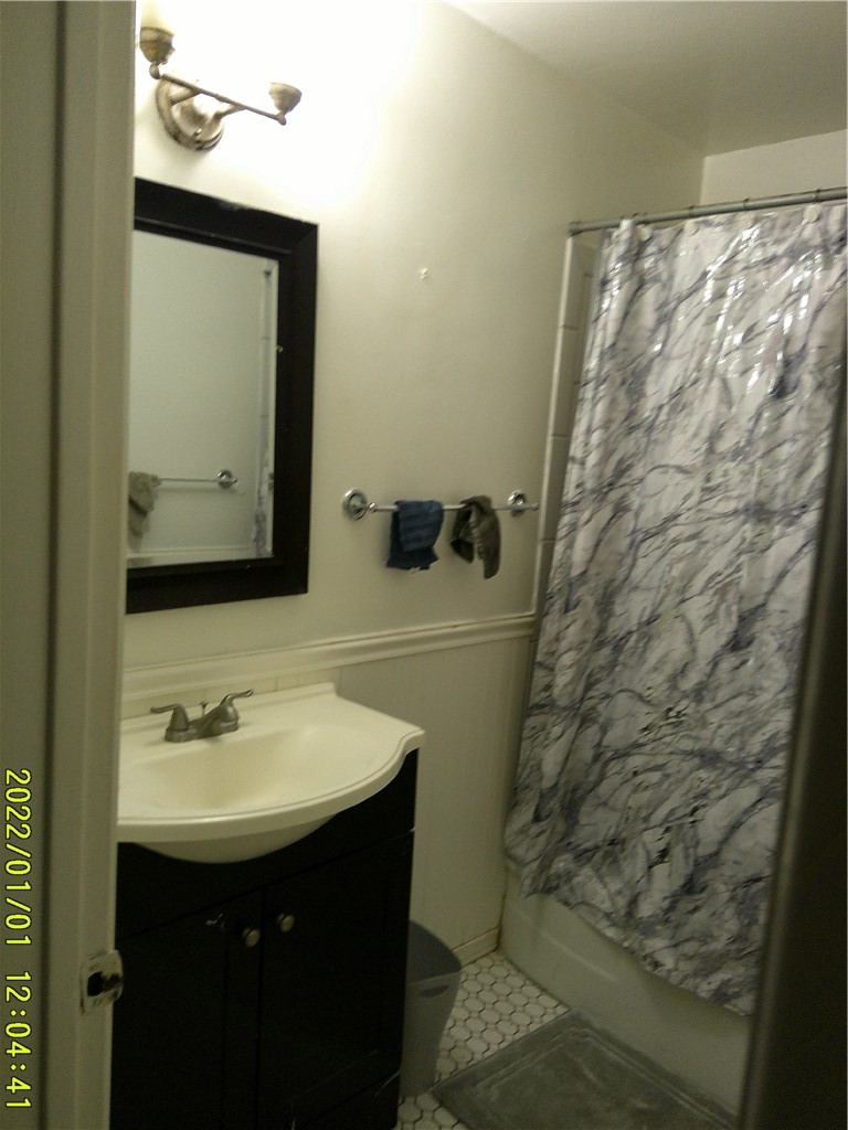 1505 West 136th Street Compton, CA 90222 - Photo 4 of 6 a bathroom with a sink and a mirror