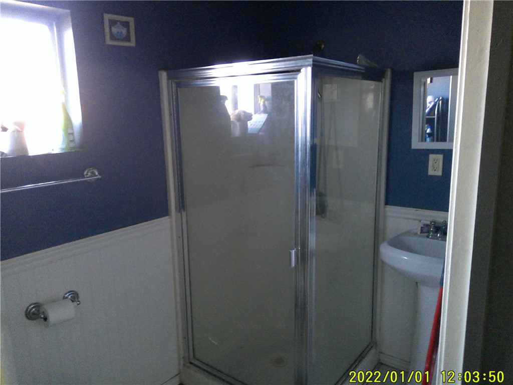 1505 West 136th Street Compton, CA 90222 - Photo 6 of 6 a bathroom with a glass shower door