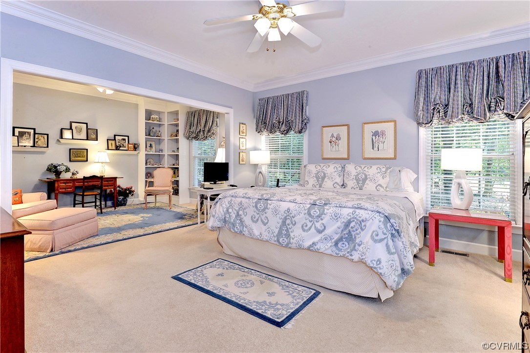 109 Butler Williamsburg, VA 23188 - Photo 15 of 47 a spacious bedroom with a large bed a chandelier and windows