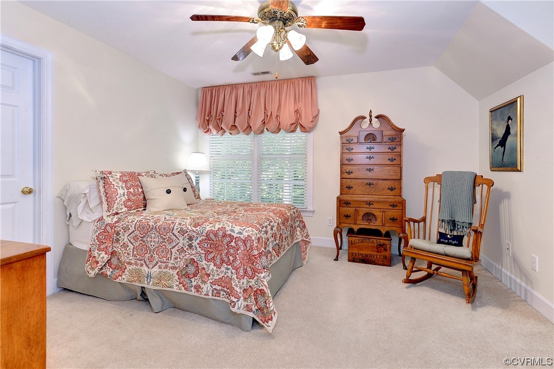 109 Butler Williamsburg, VA 23188 - Photo 24 of 47 a bedroom with a bed and a chandelier