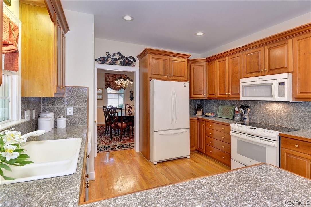 109 Butler Williamsburg, VA 23188 - Photo 10 of 47 a kitchen with stainless steel appliances granite countertop a refrigerator sink and cabinets