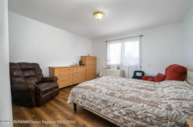 a bedroom with a bed and couch