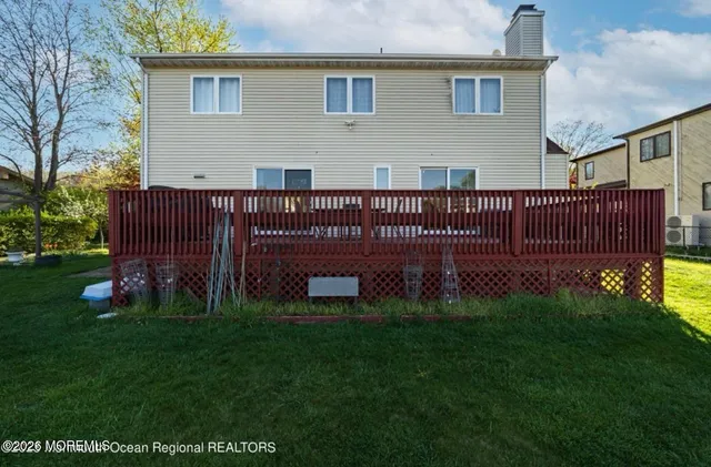 a view of backyard with deck