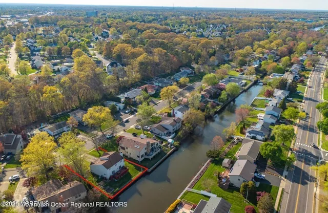 an aerial view of a house with a swimming pool