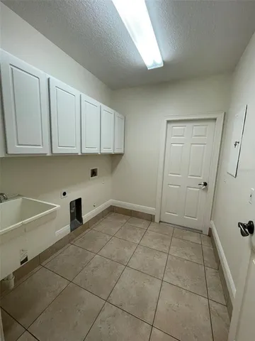 a view of a kitchen with a sink cabinets and a window
