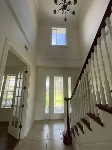 a view of entryway with wooden floor and stairs