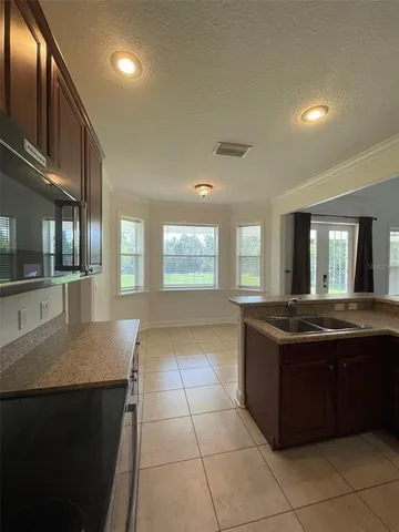 a kitchen with a stove and cabinets
