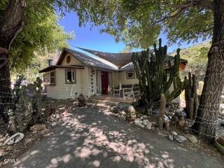 8416 Wheeler Canyon Road Santa Paula, CA 93060 - Photo 46 of 48 a front view of a house with a yard