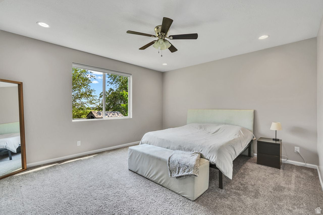 3269 West 650 North Layton, UT 84041 - Photo 14 of 35 Carpeted room with a large window, recessed lighting, and a ceiling fan
