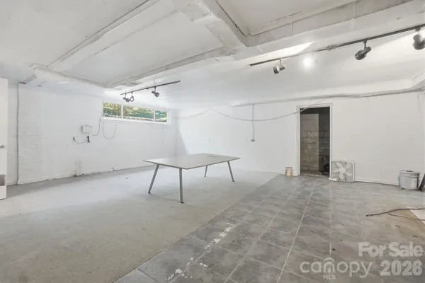 a white toilet sitting next to a bathroom sink