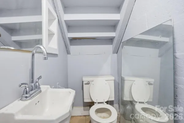 an empty room with a empty space and windows