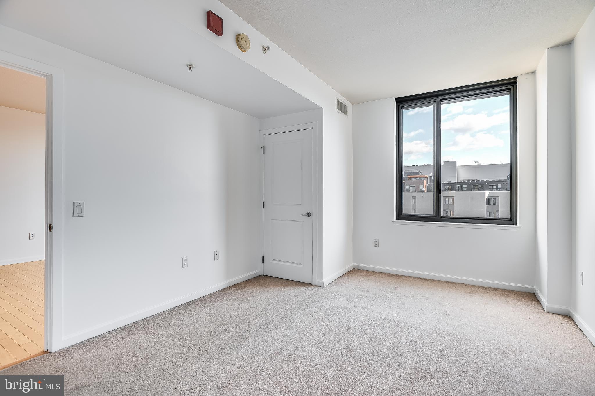 440 L Street Northwest, Unit 913 Washington, DC 20001 - Photo 18 of 42 a view of an empty room with a window