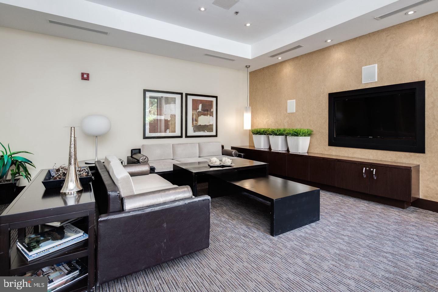 440 L Street Northwest, Unit 913 Washington, DC 20001 - Photo 2 of 42 a living room with furniture and a flat screen tv