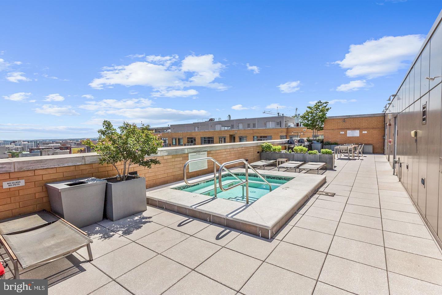 440 L Street Northwest, Unit 913 Washington, DC 20001 - Photo 32 of 42 a view of roof deck with dining table and chairs