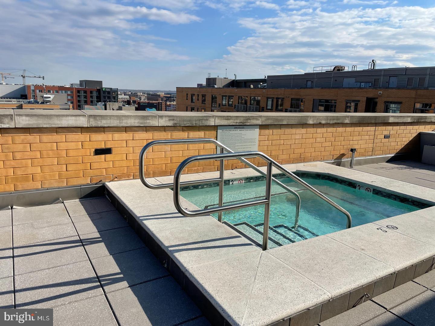 440 L Street Northwest, Unit 913 Washington, DC 20001 - Photo 35 of 42 a view of a swimming pool with a lounge chair