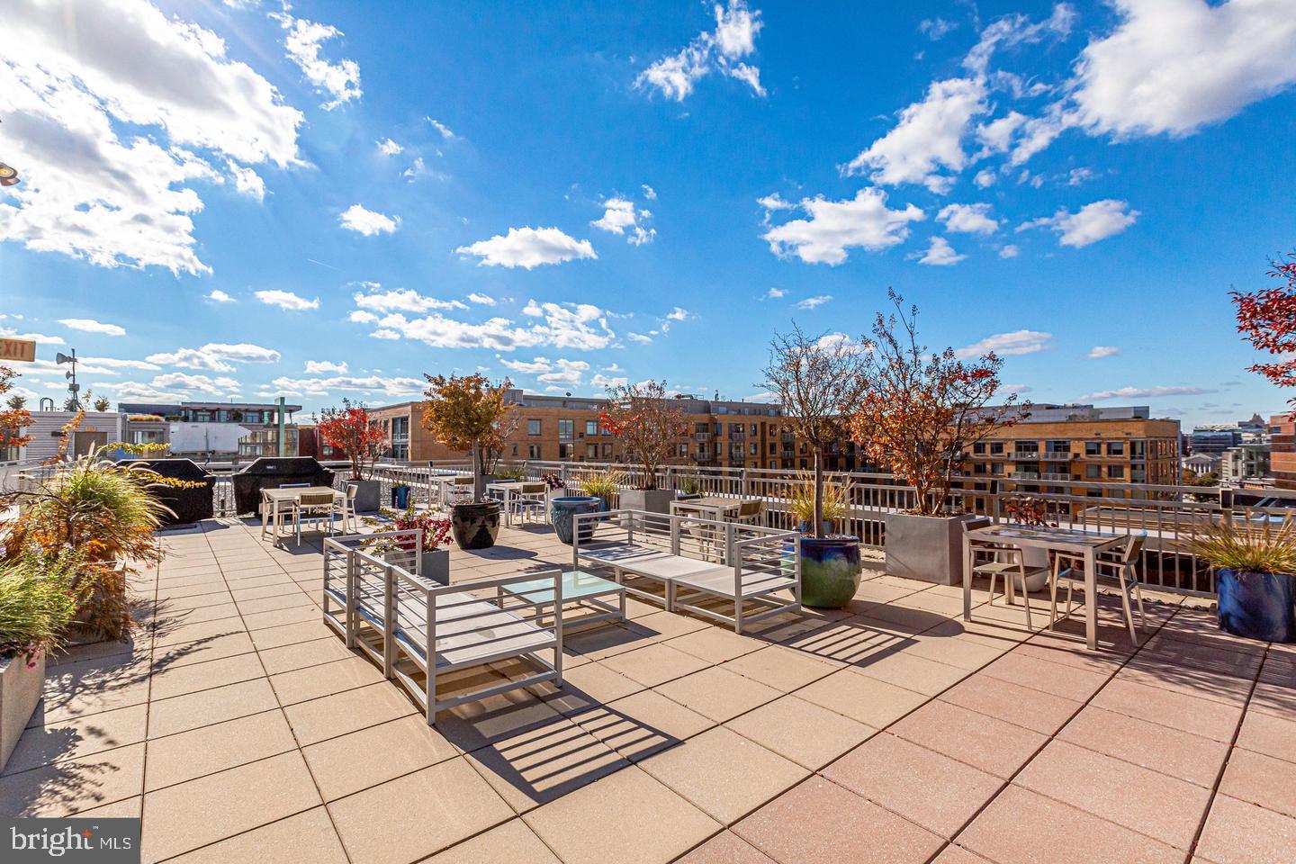 440 L Street Northwest, Unit 913 Washington, DC 20001 - Photo 6 of 42 a view of a terrace with dining table and chairs