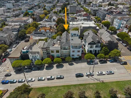 an aerial view of residential houses with outdoor space