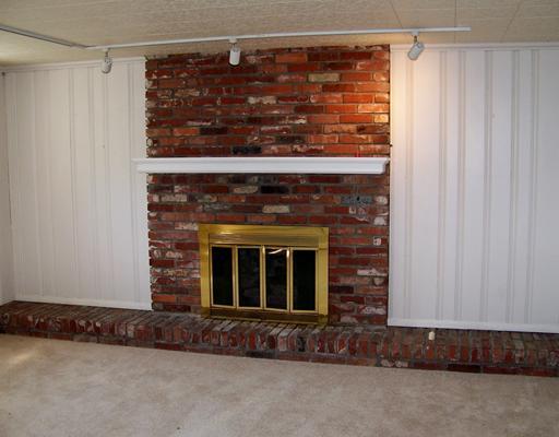 147 Byron Road Pittsburgh, PA 15237 - Photo 7 of 8 Family Room. 15 x 11 lower level Family room offers panaling & fireplace.