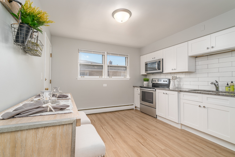 36 South Kensington Avenue, Unit 5 La Grange, IL 60525 - Photo 5 of 23 a kitchen with a sink stove and cabinets