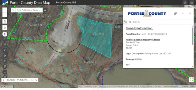 a front view of a house with cars parked