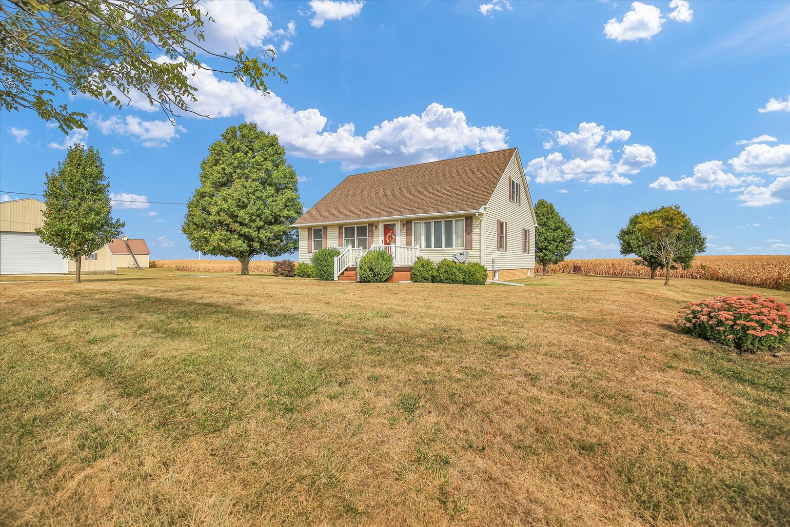 2151 East 2600 North Road Armstrong, IL 61812 - Photo 1 of 56 a view of a house with a big yard and potted plants