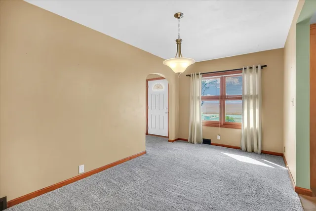 a kitchen with a stove a sink and a window