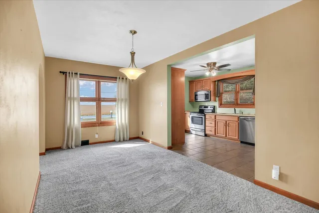 a kitchen with stainless steel appliances a stove sink and cabinets