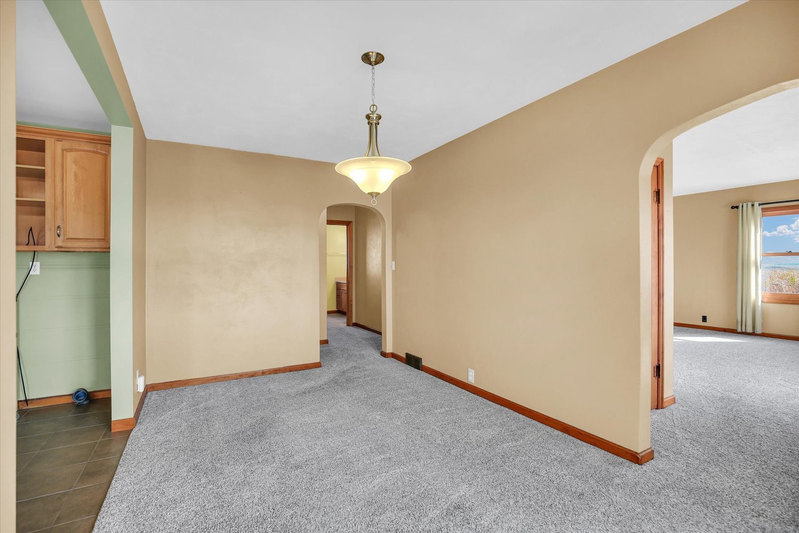 2151 East 2600 North Road Armstrong, IL 61812 - Photo 16 of 56 an empty room with chandelier fan and windows