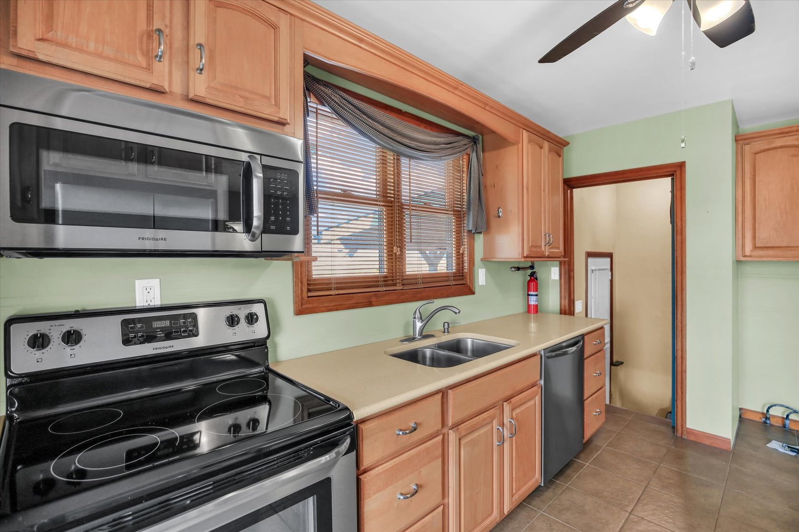 2151 East 2600 North Road Armstrong, IL 61812 - Photo 18 of 56 a kitchen with stainless steel appliances a stove sink and cabinets