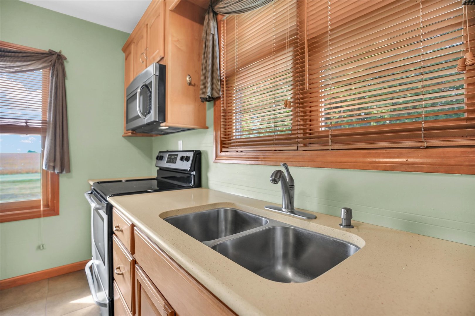 2151 East 2600 North Road Armstrong, IL 61812 - Photo 19 of 56 a kitchen that has a sink and a window