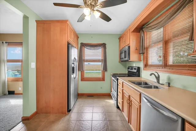 a view of a room with wooden floor and bathroom view