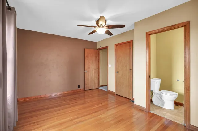 a view of a livingroom with a chandelier fan