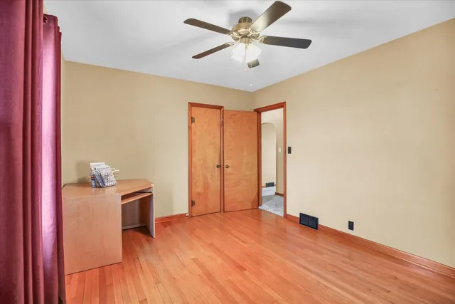 a view of an empty room with wooden walls
