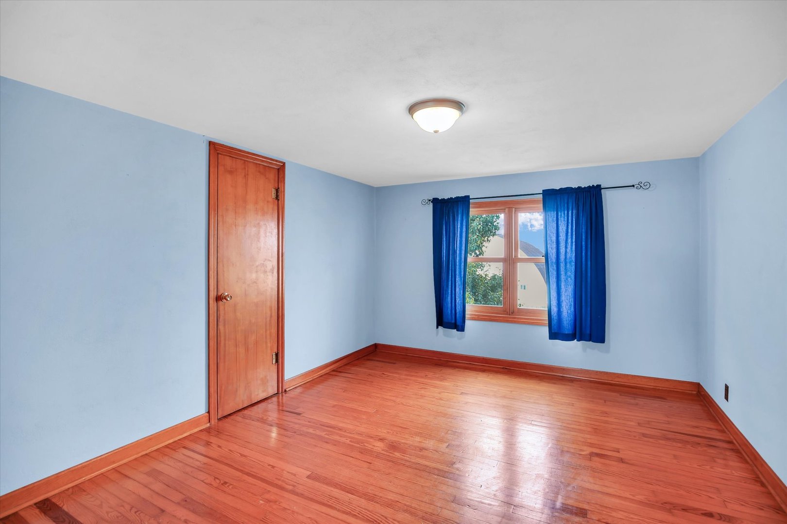 2151 East 2600 North Road Armstrong, IL 61812 - Photo 32 of 56 a view of an empty room with window and wooden floor