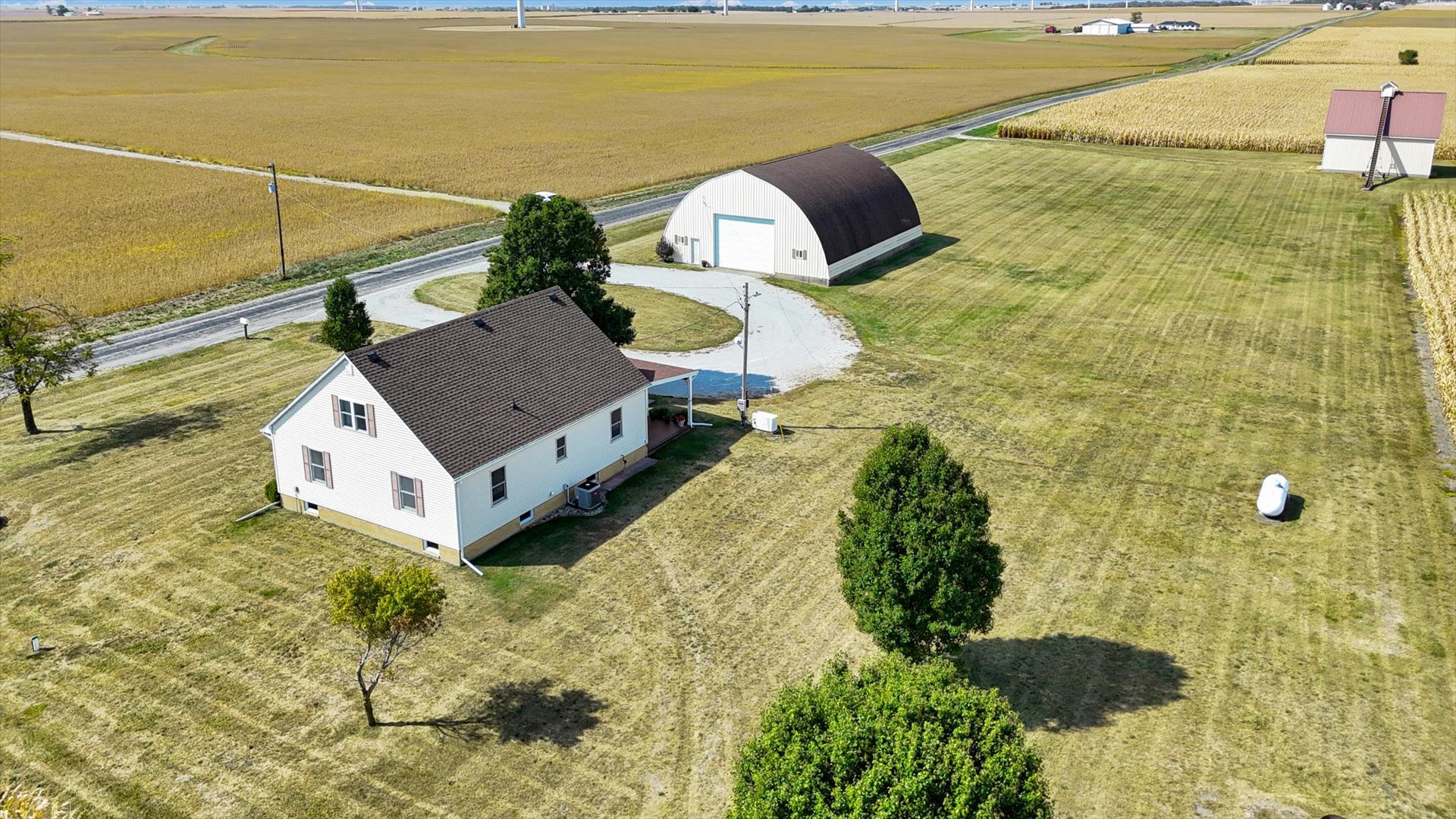 2151 East 2600 North Road Armstrong, IL 61812 - Photo 45 of 56 a aerial view of a house with a yard and large tree