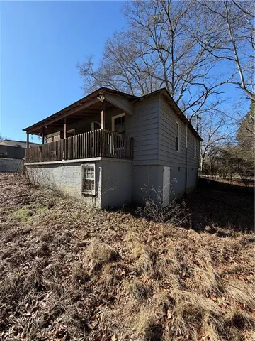 a house with trees in the background