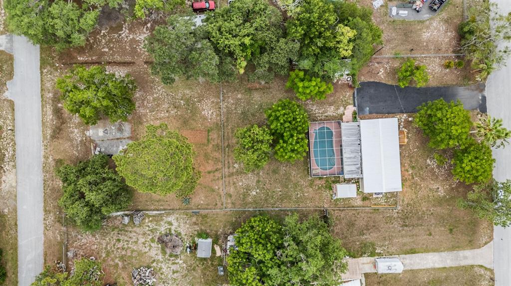 9739 Ray Street Hudson, FL 34669 - Photo 7 of 36 an aerial view of a house with a yard