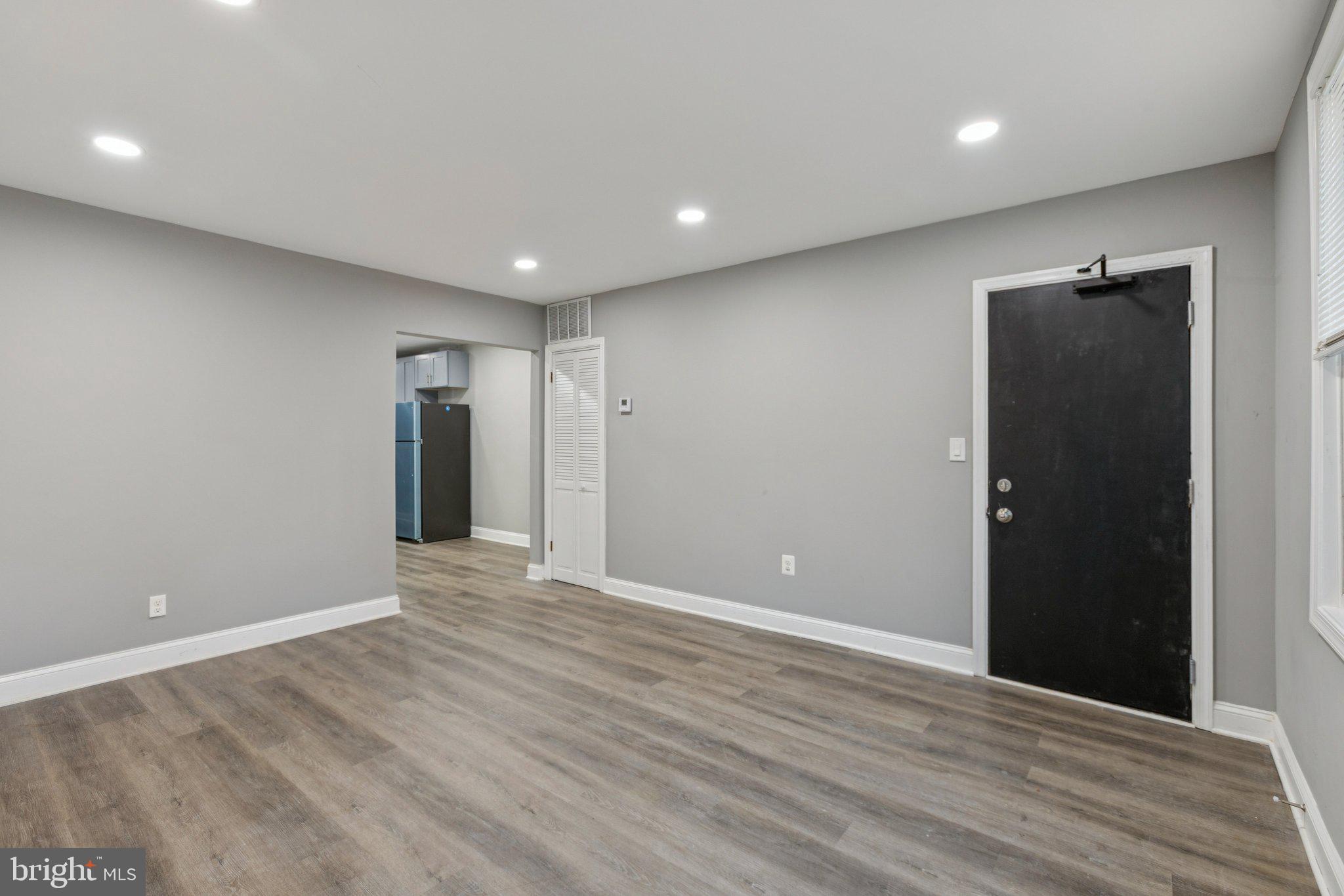 405 34th Street Southeast, Unit 1 Washington, DC 20019 - Photo 4 of 17 a view of an empty room with wooden floor