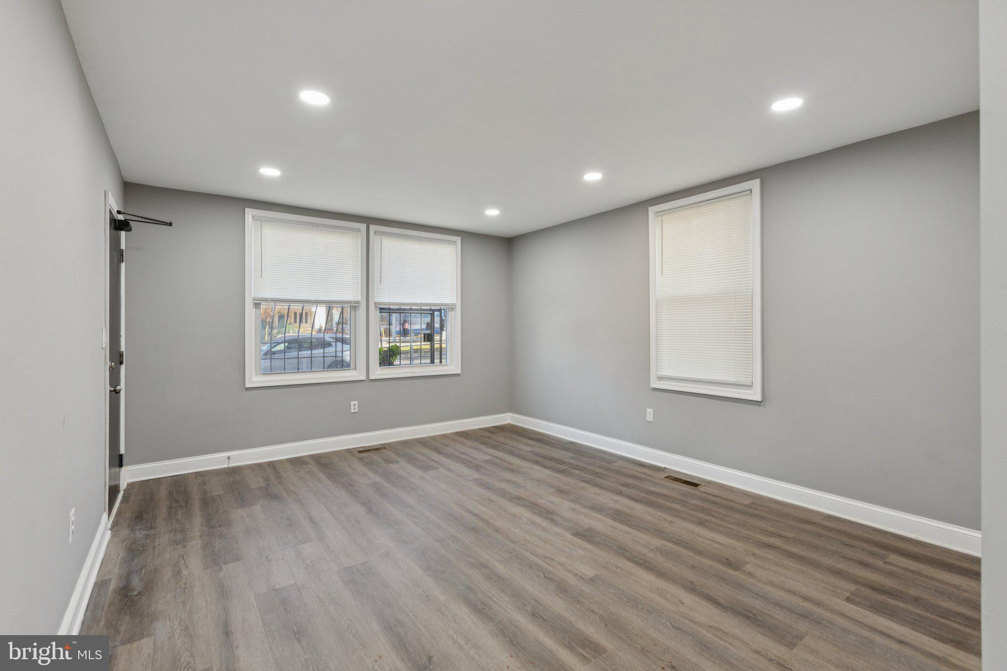 405 34th Street Southeast, Unit 1 Washington, DC 20019 - Photo 6 of 17 wooden floor in an empty room with a window