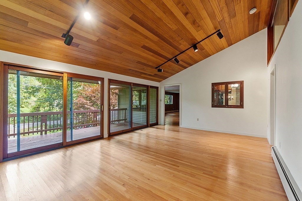342 Taylor Road Stow, MA 01775 - Photo 20 of 42 a view of an empty room with wooden floor and a window