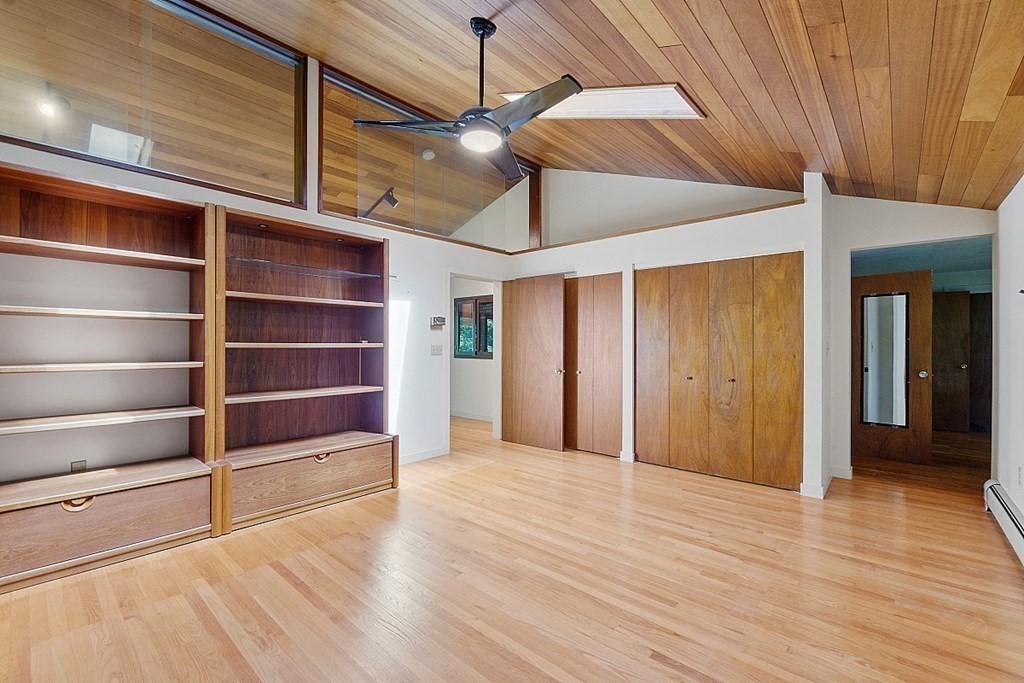 342 Taylor Road Stow, MA 01775 - Photo 24 of 42 a view of an empty room with a window and wooden floor