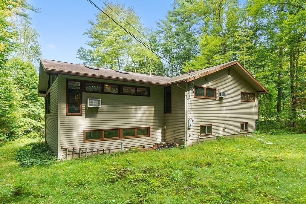 342 Taylor Road Stow, MA 01775 - Photo 41 of 42 a front view of house with yard and green space