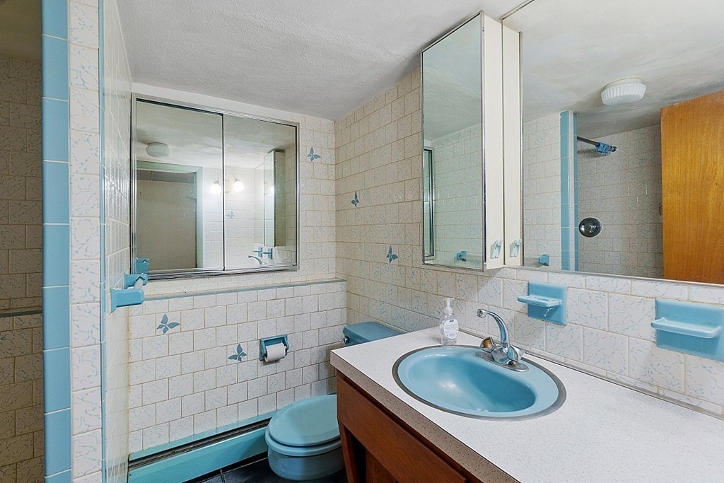 342 Taylor Road Stow, MA 01775 - Photo 10 of 42 a bathroom with a sink a toilet and mirror