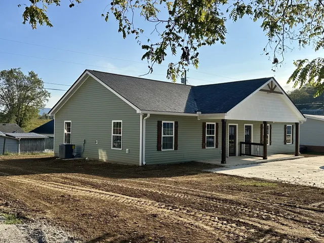 a house with trees in the background