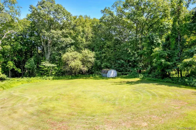 a view of a swimming pool with an outdoor space and seating area