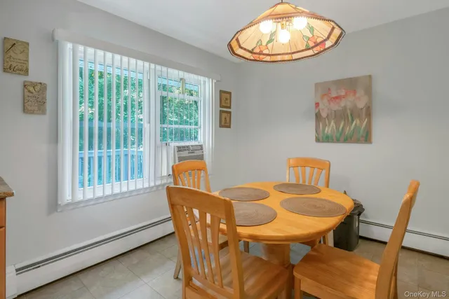 a view of a dining room with furniture window and outside view