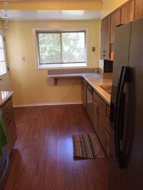4773 Myrtlewood Road Jacksonville, FL 32210 - Photo 7 of 12 workspace with wooden floor and windows