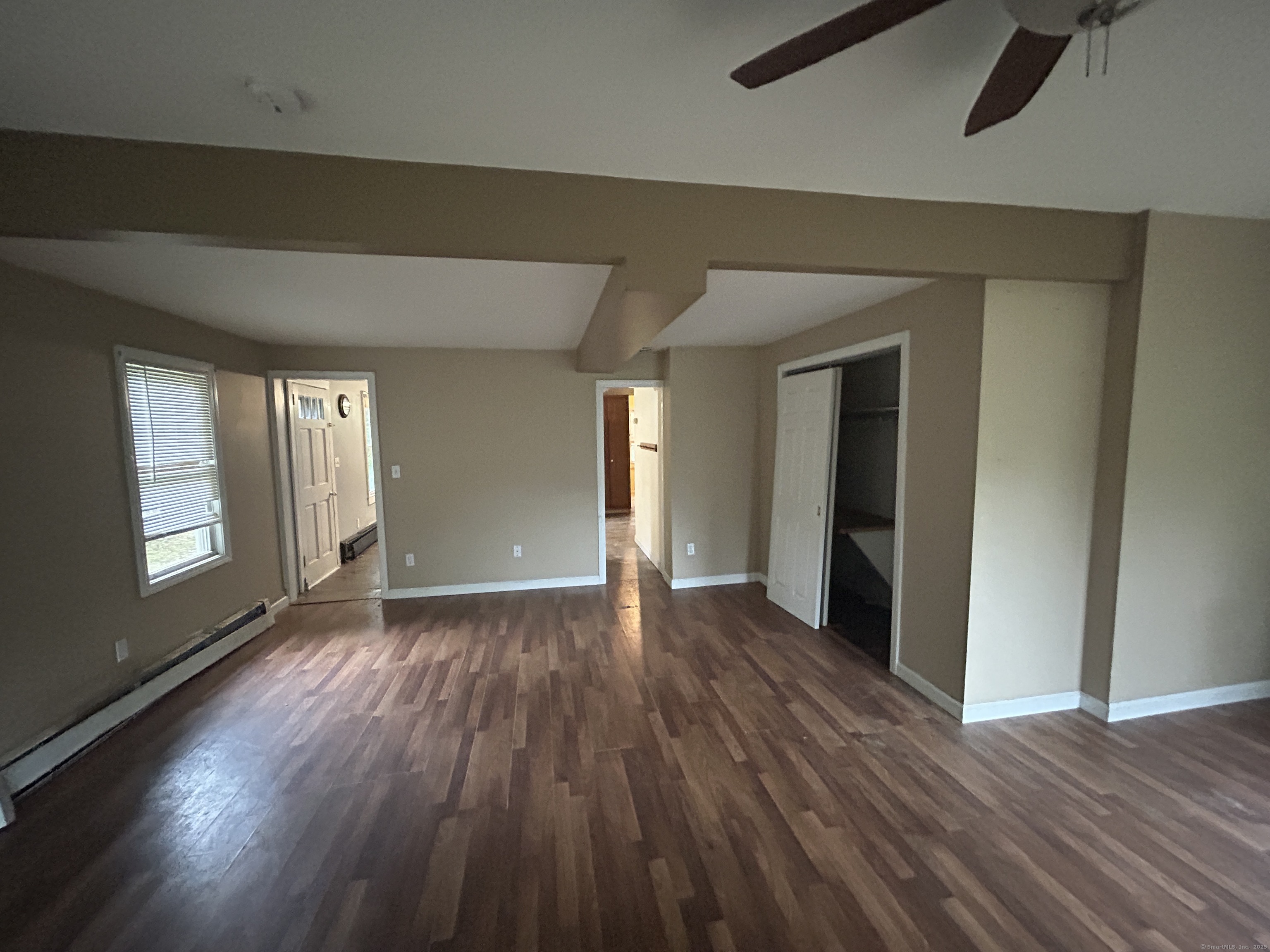 53 Falls Bashan Road East Haddam, CT 06469 - Photo 11 of 32 an empty room with wooden floor and windows