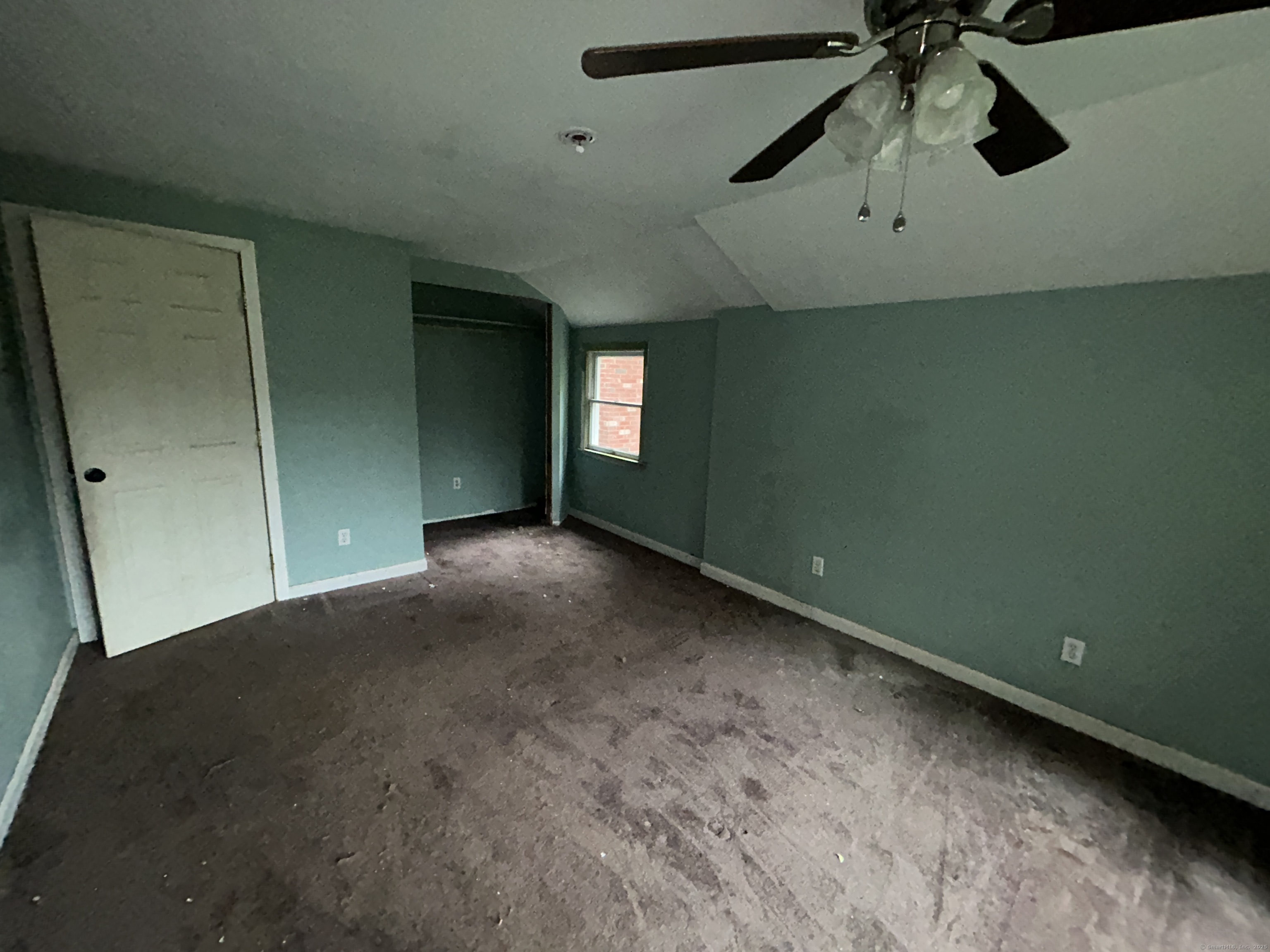 53 Falls Bashan Road East Haddam, CT 06469 - Photo 26 of 32 an empty room with a ceiling fan and a window
