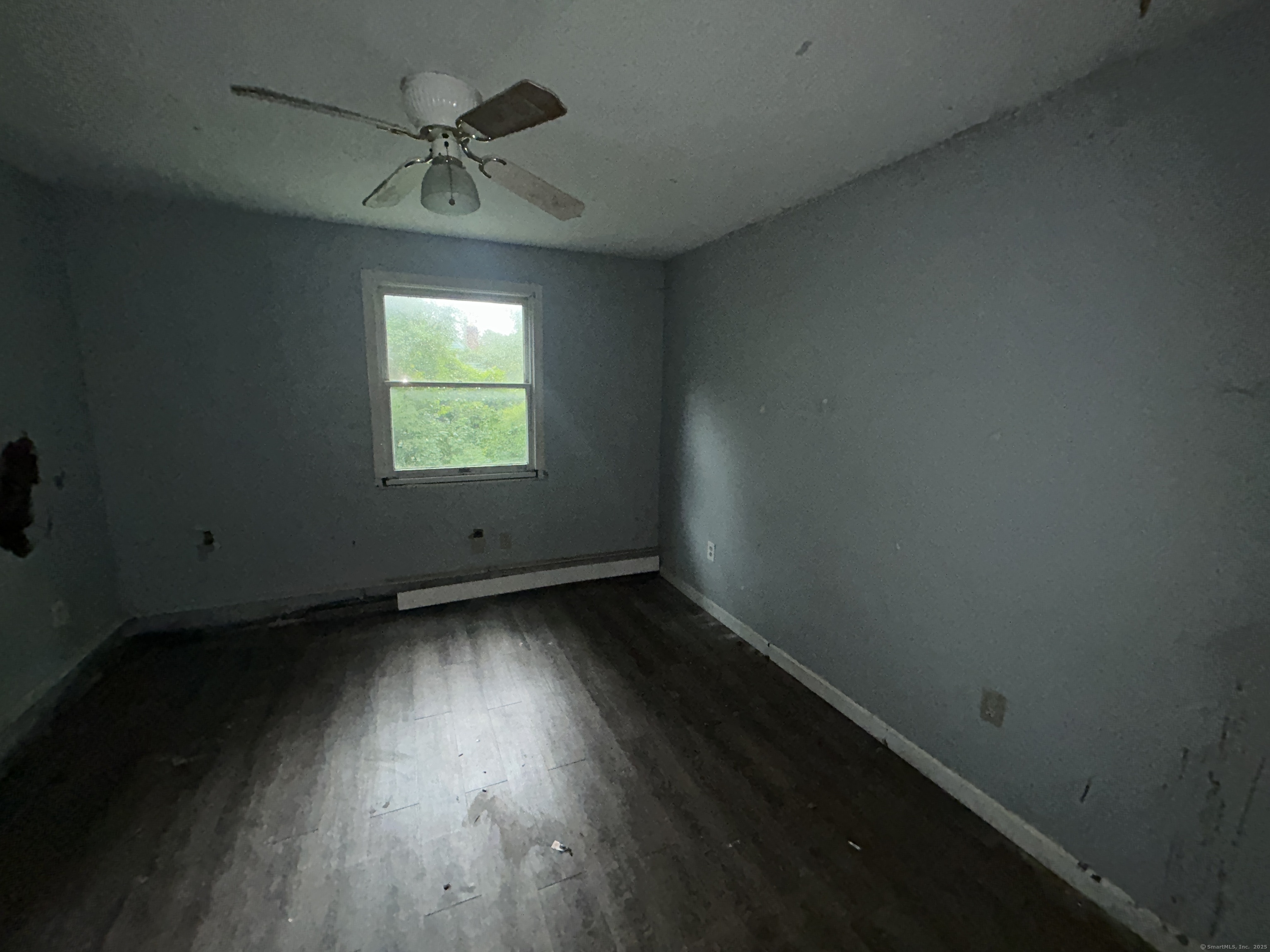 53 Falls Bashan Road East Haddam, CT 06469 - Photo 31 of 32 an empty room with wooden floor and windows